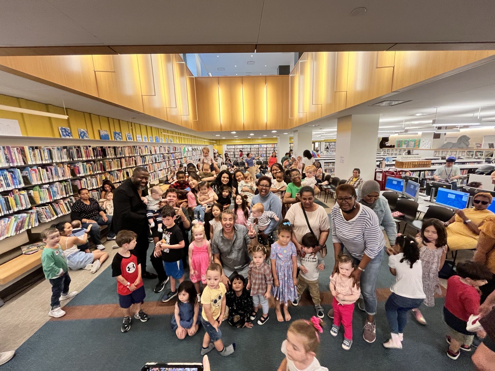 Families gathered after a Rockness Music program in a public library
