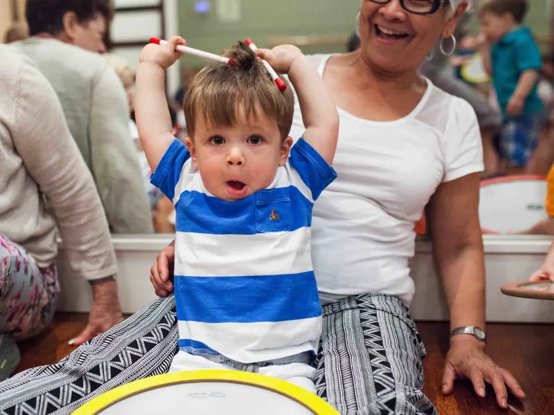 Toddler drumming in a Rockness Music class
