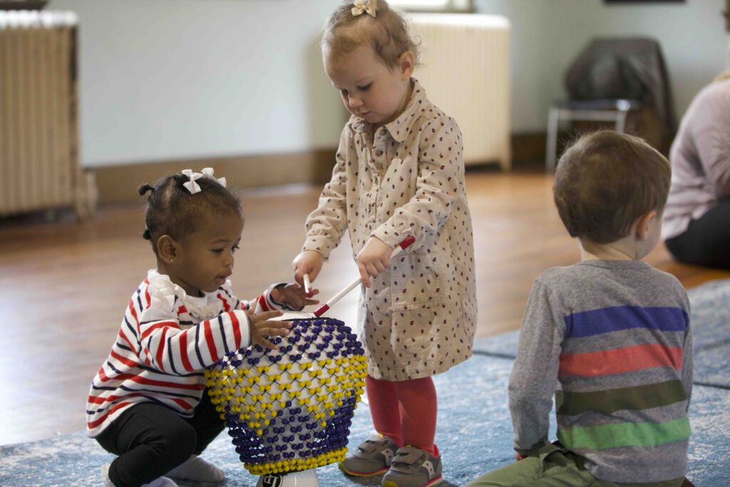 Child discovering a new instrument during Rockness Music’s Mystery Discovery activity.