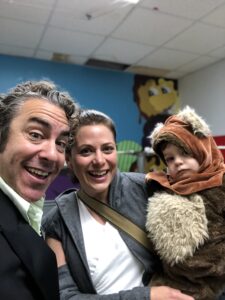 Teacher with mom and son in halloween costumes in toddler music class